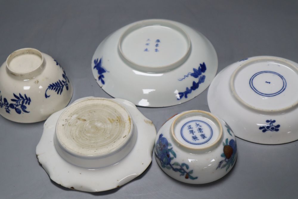 Three Chinese saucers, Chinese tea bowl, 18th century English tea bowl, largest 14cm